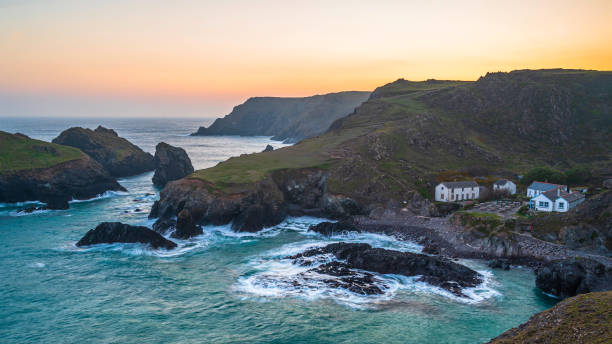istock Kynance Cove, Cornwall, England. A summers evening and the sky is glowing as the sun sets over the spectacular, rugged coastline 1804188434