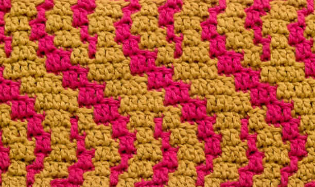istock Crochet background. Abstract mosaic magenta yellow pattern close up. Curly pattern. 1804190577