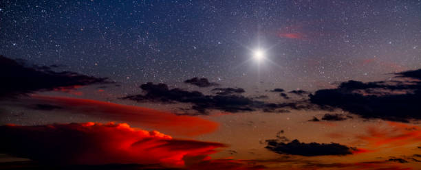 Christmas star shines at night over the mountains of Bethlehem stock photo