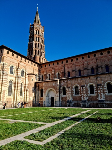 The Basilica of Saint-Sernin is a church in Toulouse. The image shows the Bell tower (The lower part Romanesque and Gothic upper part, captured during autumn season.