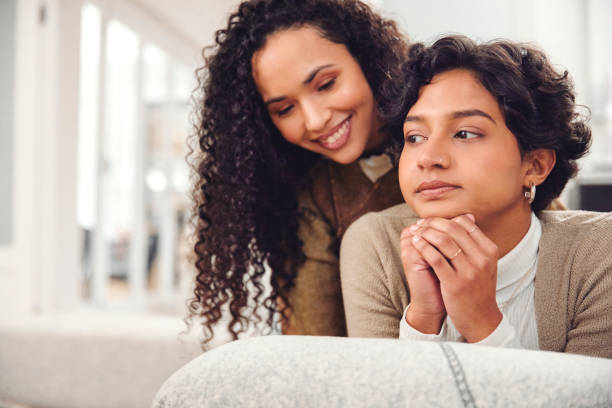 istock Thoughtful Woman Transforms Contemplation into Joyful Connection, Sharing an Affectionate Moment with Her Friend 1804216292