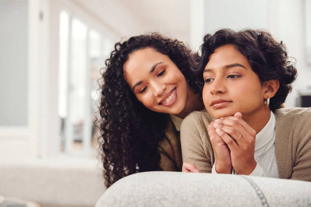 istock Thoughtful Woman Transforms Contemplation into Joyful Connection, Sharing an Affectionate Moment with Her Friend 1804216851
