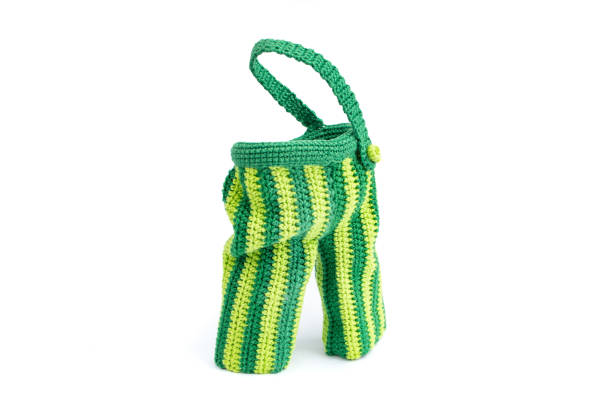 istock Crochet green clown pants, close up isolated on white background 1804220685