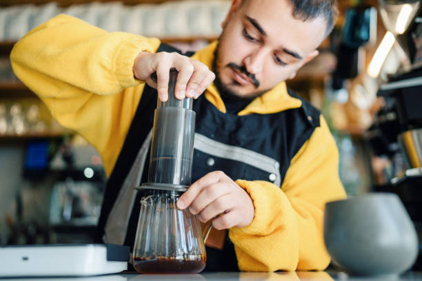 istock Barista preparing espresso coffee using Aeropress in coffee shop 1804221771