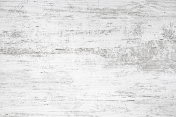 istock White table top with gray veins imprint, weathered wood backdrop, abstract texture 1804222991
