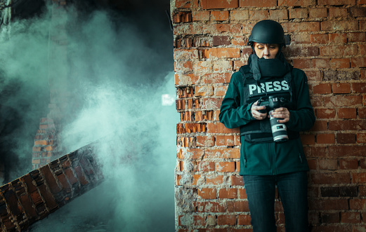 a female photojournalist in a war zone