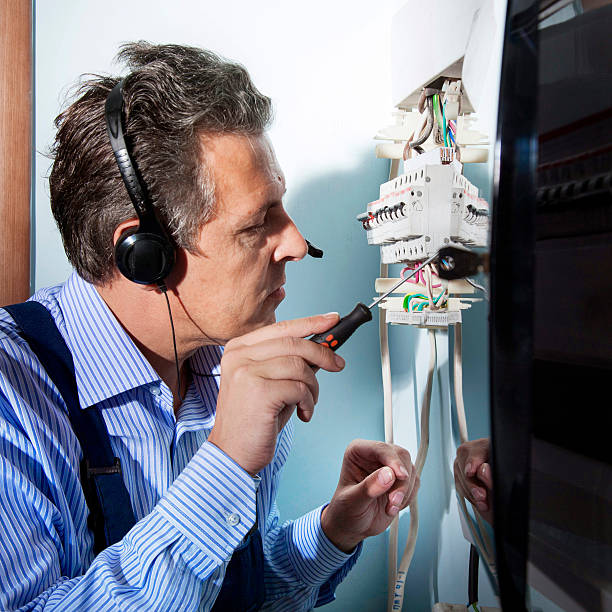 electrician at work electrician works with wires cable tester stock pictures, royalty-free photos & images