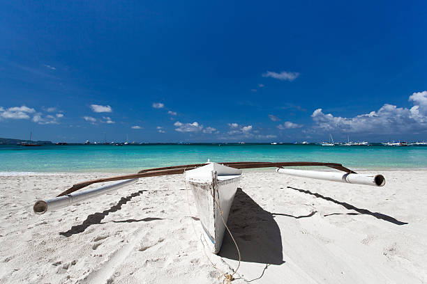 istock Wooden boat on tropical beach 180423680