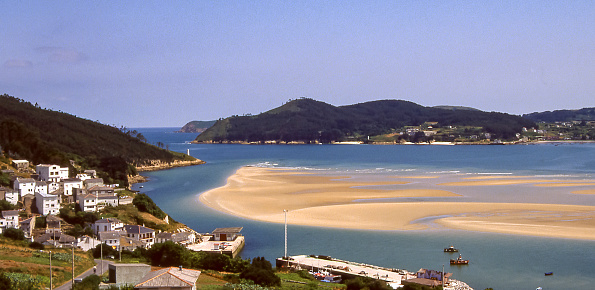 O Barqueiro, Galicia, Spain - aug 1, 1993: view of the sandbanks that emerge during low tide in O Barqueiro, Galicia, Spain