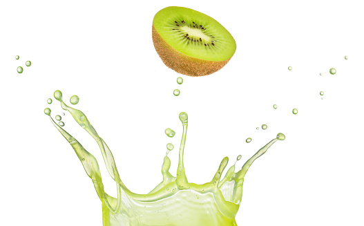 Section of ripe kiwi falling into a crown-shaped juice splash isolated on white background.
