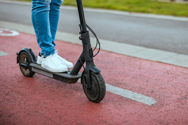 istock Unrecognizable man drives a electric scooter 1804253051