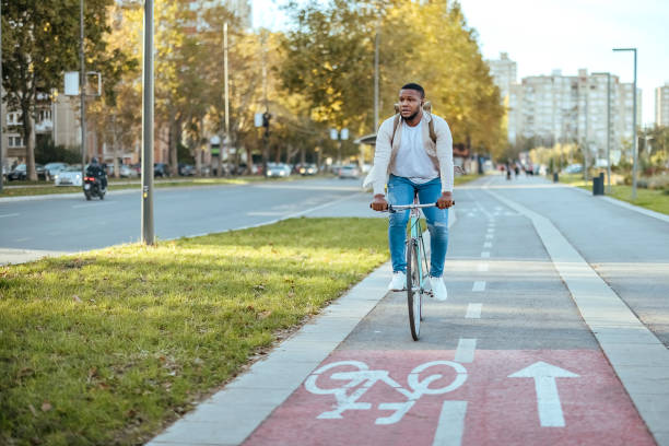 istock Cyclist in city traffic using the bicycle lane 1804255205