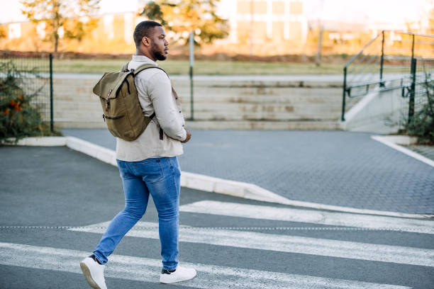 istock Man crossing a street 1804256866