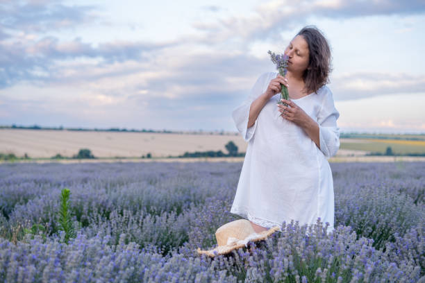 istock Lady in White in Levander Field. 1804261748