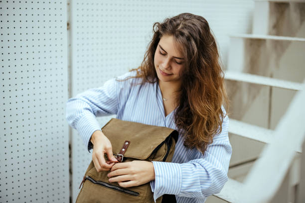 istock Young woman is sitting on the stairs 1804280502