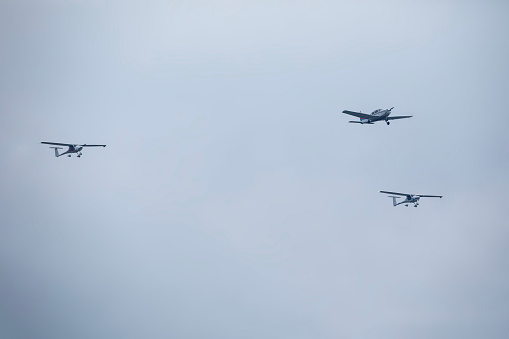 Propeller Airplanes Flying in Fleet.