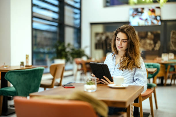 istock Young woman uses a digital tablet 1804284308