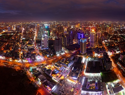 Aerial night skyline of Downtown Taichung, the vibrant metropolis in central Taiwan, with modern skyscrapers booming in the 7th Redevelopment Zone and colorful city lights dazzling in the dark
