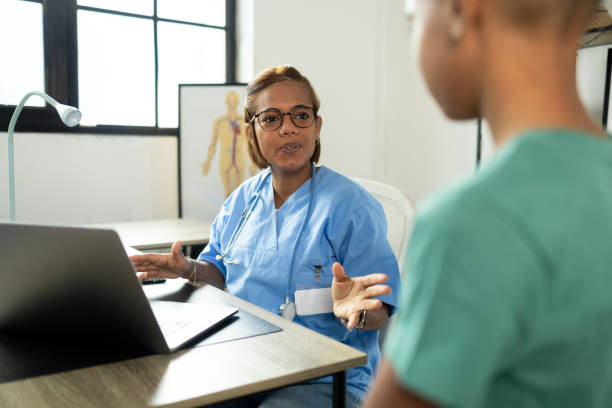 istock Female pediatrician having a boy on checkup 1804295372