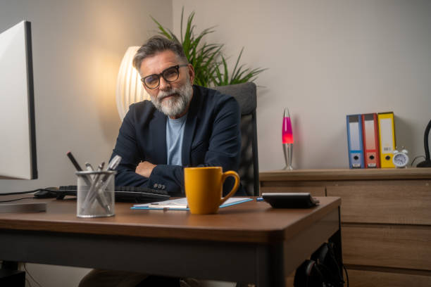 istock Smiling mature businessman in his office 1804300712