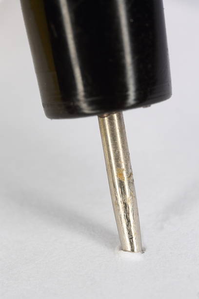 istock Macro (close-up) of Black Pushpin (thumbtack) isolated on squares 180430247