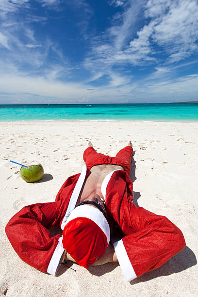 istock Santa Claus on beach relaxing 180430443