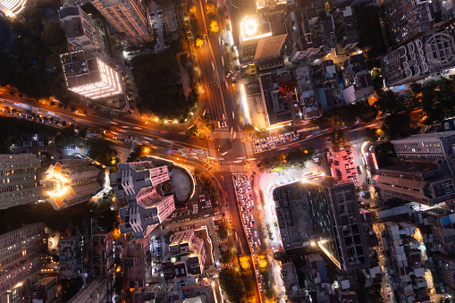 An overhead shot of traffic flow at an intersection in Siming District, Xiamen City, a second-tier city in the world, at night