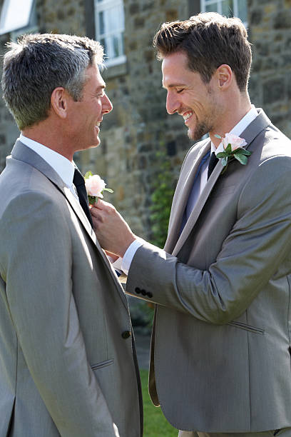 istock Best man and groom smiling at a wedding 180430761