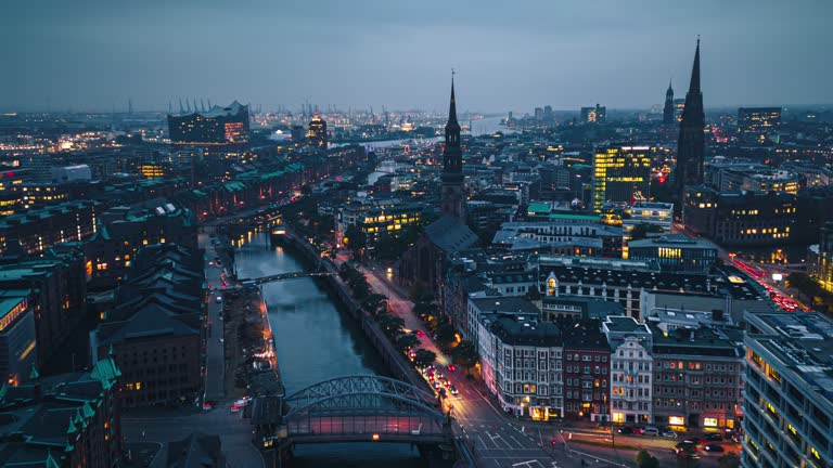 Aerial view Hyper lapse Footage of above Hamburg Cityscape at evening time, Germany