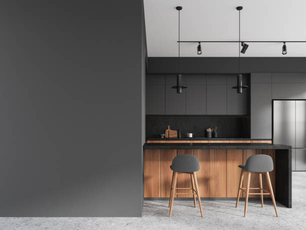 istock Gray and wooden kitchen interior with island and blank wall 1804324502