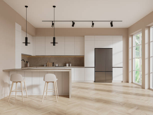 istock Beige home kitchen interior with cooking room, bar counter and panoramic window 1804327782