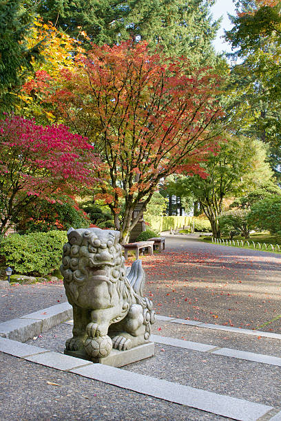 istock Shishi Lion Protector Stone Statue in Japanese Garden 180433588