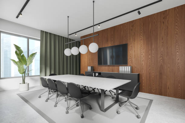 istock Stylish conference room interior with office board and tv, panoramic window 1804336867