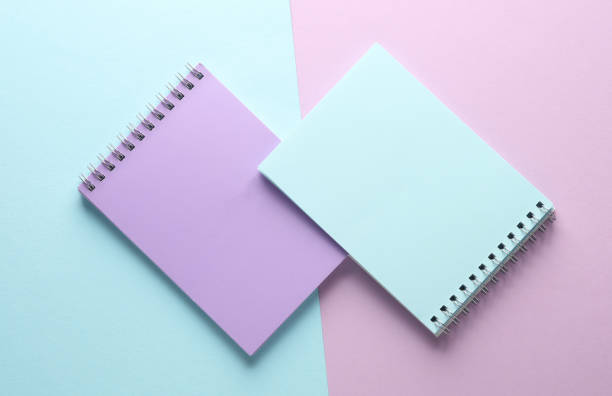 istock Two notebooks on blue purple pastel background. Minimalism. Creative layout 1804339578