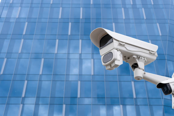 istock CCTV camera front of office building. Close-up. 1804340670