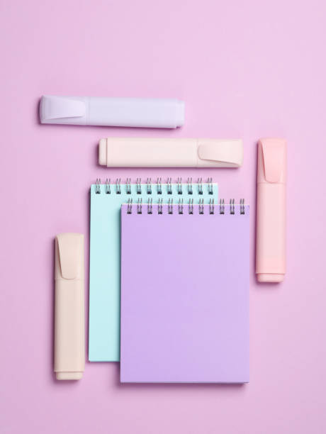 istock Markers or colored felt-tip pens with notebooks on pastel background. Creative layout. Top view 1804342870
