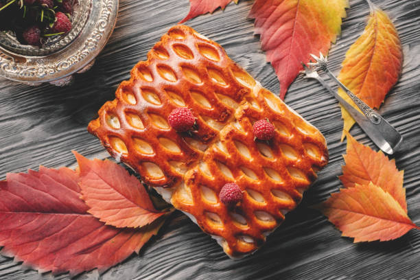Traditional pastry pie with berries top view. wicker homemade pie is lying on a rustic table. cake for Thanksgiving