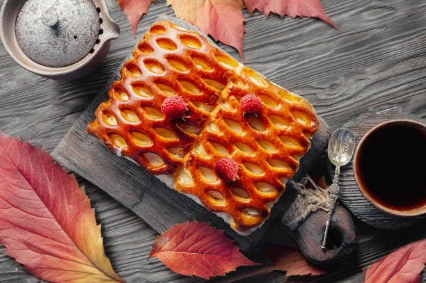 Traditional pastry pie with berries top view. wicker homemade pie is lying on a rustic table. cake for Thanksgiving.