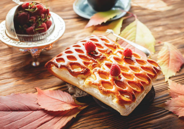 Traditional pastry pie with berries top view. wicker homemade pie is lying on a rustic table. cake for Thanksgiving.
