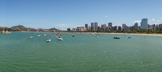 Vitoria bay with sail boats and buildings on summer daytime. Espirito Santo, Brazil.