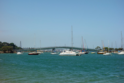 Vitoria bay with sail boats and bridge on summer daytime. Espirito Santo, Brazil.