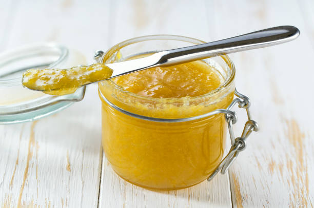 istock Lemon jam on a white wooden table, selective focus.
Jar of lemon jam on the table. 1804373665