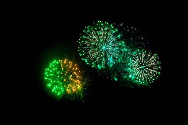 istock green fireworks on a black background. Festive Christmas lighting element for decoration. Sparks. Fireworks Are A Class Of Explosive Pyrotechnic Devices Used For Aesthetic Purposes. Isolated on black magic light effect 1804380047