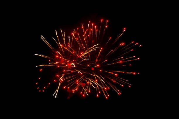 istock Red fireworks on a black background. Festive Christmas lighting element for decoration. Sparks. Fireworks Are A Class Of Explosive Pyrotechnic Devices Used For Aesthetic Purposes. Isolated on black magic light effect 1804380068