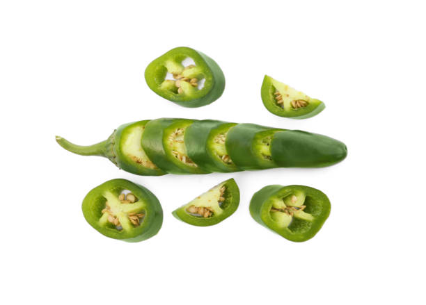istock Whole and cut green hot chili peppers on white background, flat lay 1804382219