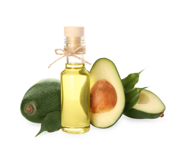 istock Cooking oil and fresh avocados isolated on white 1804383309