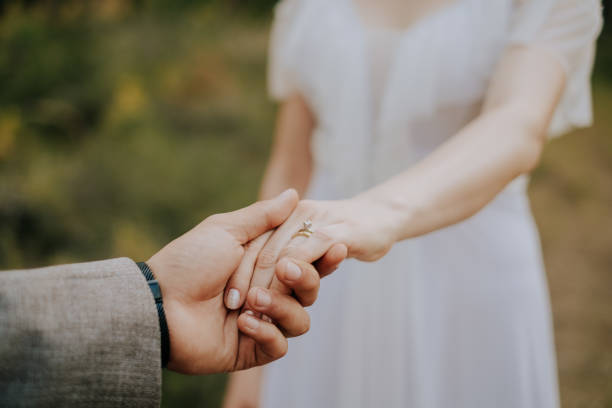 istock Partial view of lovers holding hands 1804398468