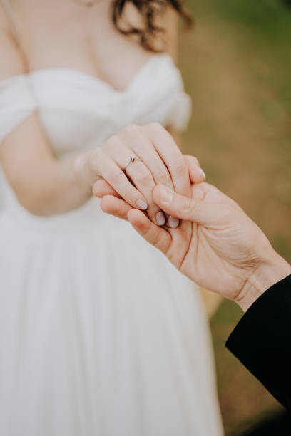 istock Partial view of lovers holding hands 1804398510