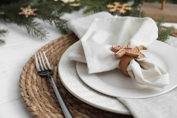 istock Beautiful festive place setting with stylish decor for Christmas dinner on white wooden table, closeup 1804409962
