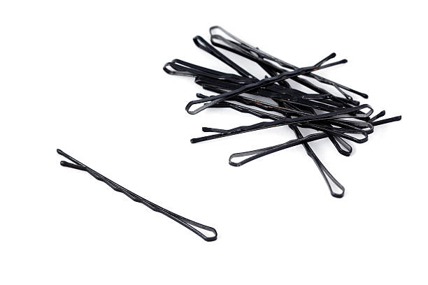 istock Hair clips pile isolated on white background 180441094